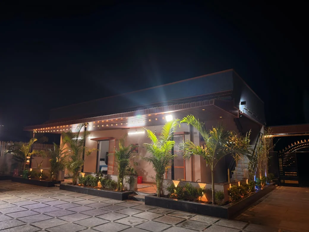 AVULA’S RESORTS entrance and building lit at night